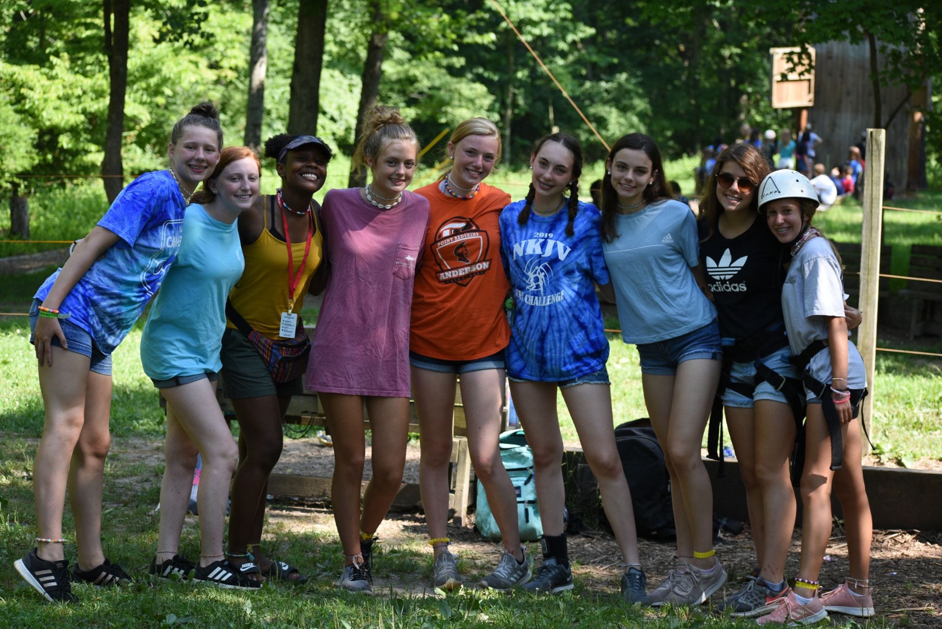 Teen Group With Counselor At Ropes